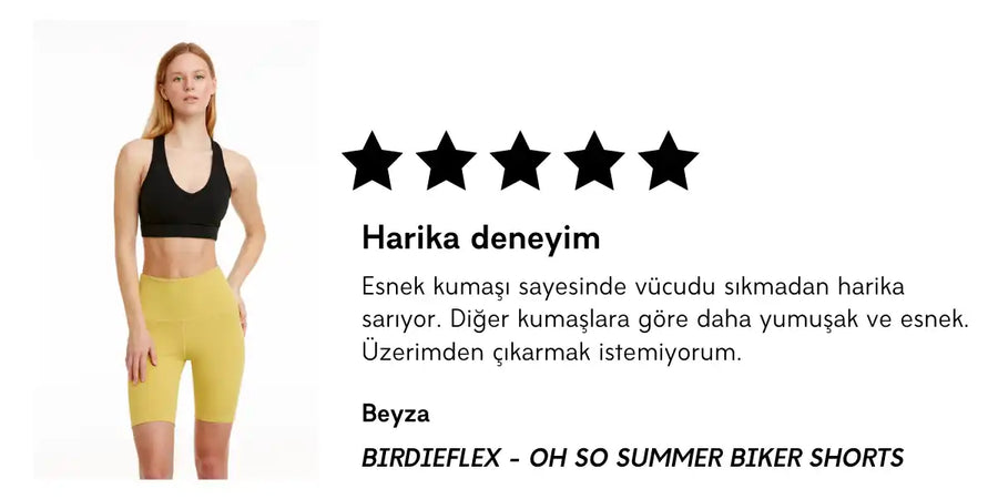 Siyah üst ve sarı bisiklet şortları giyen kadın.