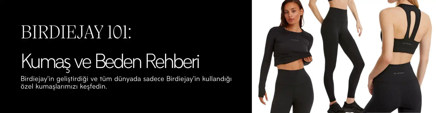 Kısa tişört ve yüksek bel tayt içeren siyah sporcu antrenman kıyafeti seti.